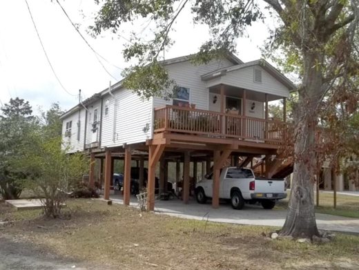 Elevated home with pressure-treated driven piles.