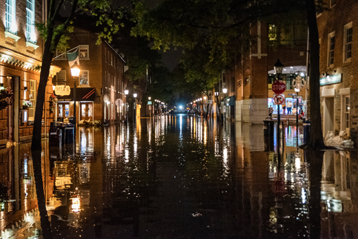 Picture taken at night of flooding in Old Town Alexandria, VA, after six inches of rain.