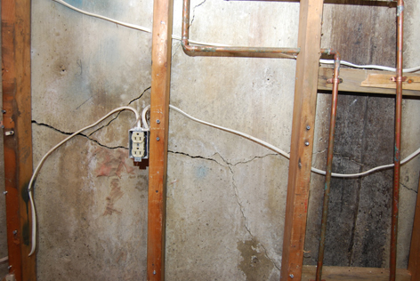 Cracked east wall. Foundation company will fix wall from the outside, then add steel supports inside.