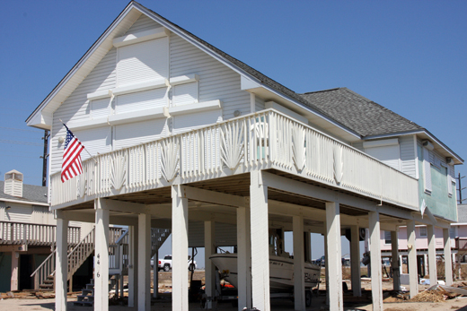 This house fared well and received only minor cosmetic damage from Hurricane Ike because of mitigating protective measures taken. Storm panels over every opening and being on stilts contributed to protecting this structure from high winds and storm surge.